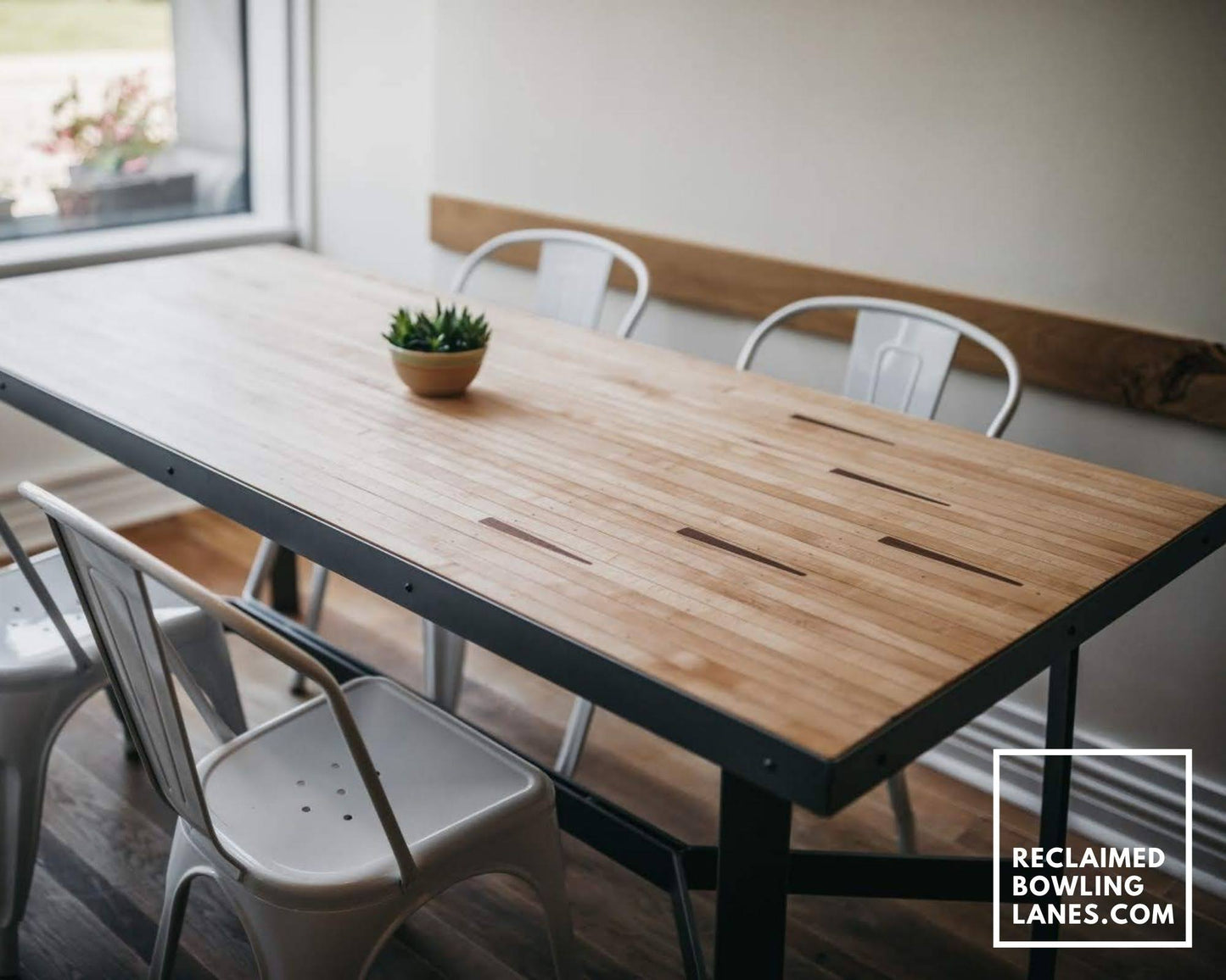 dining table made from vintage maple bowling alley wood with arrows