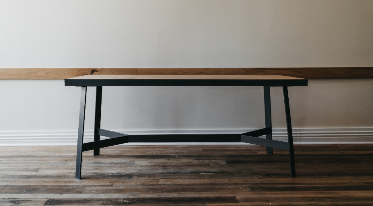 dining table made from vintage maple bowling alley wood with arrows